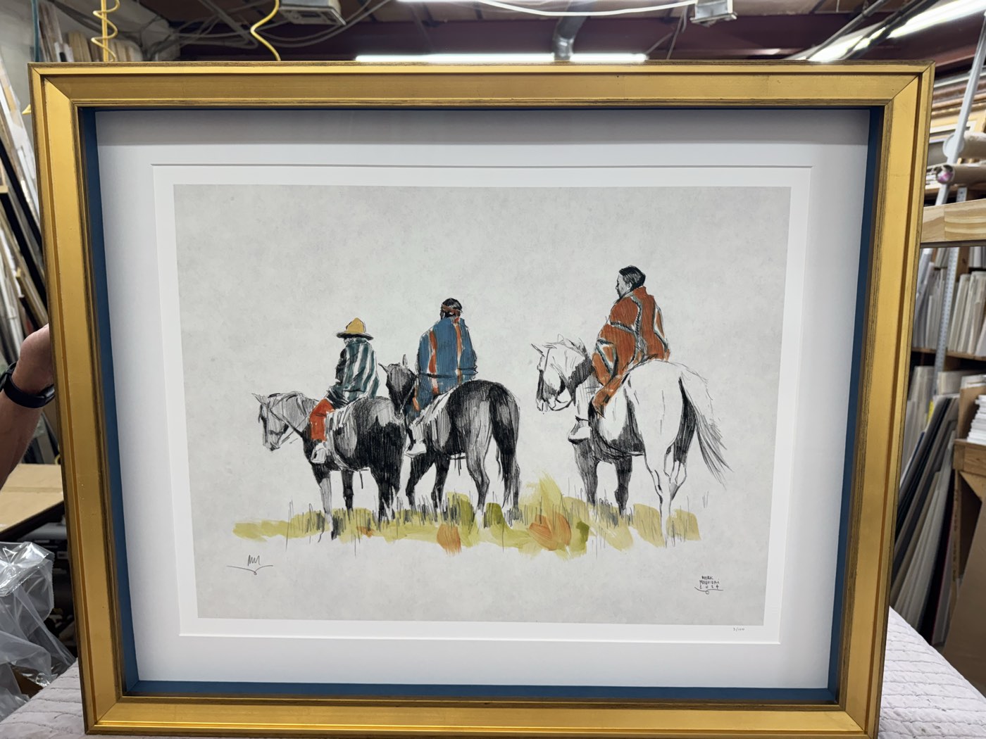 Framed Western artwork finished at the Camp Bowie shop